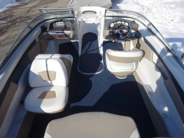 Slide: The Image of Interior of a 2006 Four Winns 200 Horizon boat with white seating. - 4
