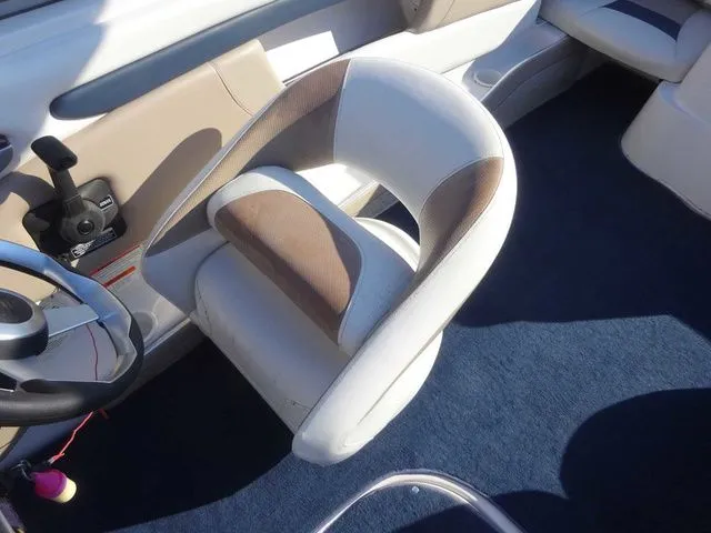 Slide: The Image of Interior of a 2006 Four Winns 200 Horizon boat with blue carpet. - 7