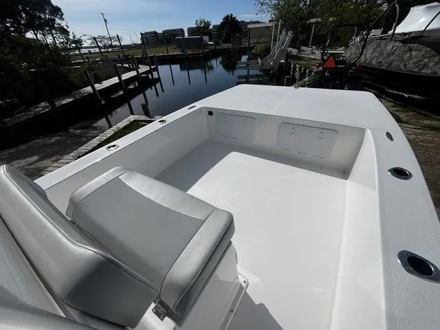 Slide: The Image of Bay Rider 2260 boat 2026 at dock with seating area. - 7