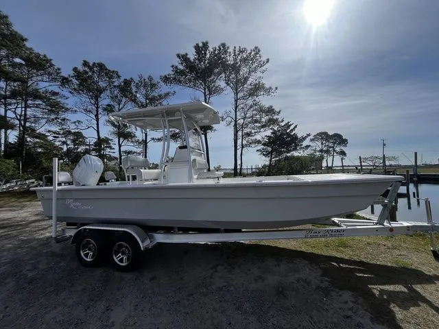 The Image of 2026 Bay Rider 2260 boat on trailer outdoors. - 1