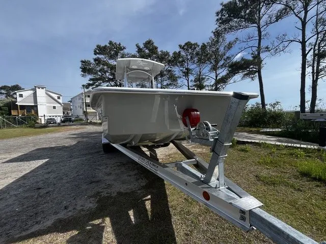 Slide: The Image of 2026 Bay Rider 2260 boat on trailer, parked outdoors. - 2
