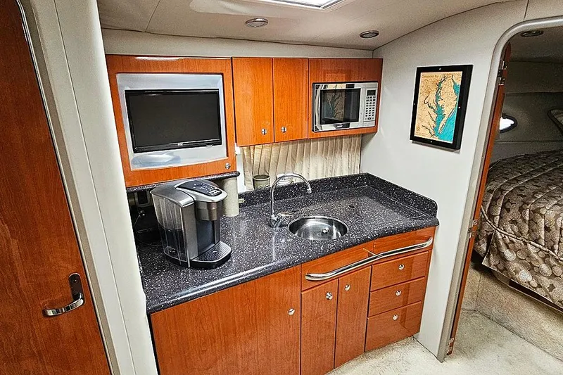 Slide: The Image of Luxurious 2006 Formula 37 Performance Cruiser interior kitchen with modern amenities. - 10