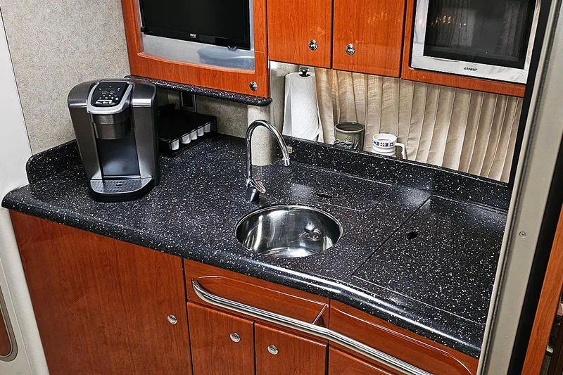 Slide: The Image of 2006 Formula 37 Performance Cruiser kitchen with sleek countertop and modern appliances. - 12