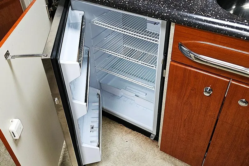 Slide: The Image of Open refrigerator in 2006 Formula 37 Performance Cruiser kitchen area. - 14