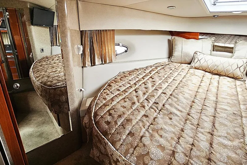 Slide: The Image of Luxurious interior of a 2006 Formula 37 Performance Cruiser with elegant bedding and modern amenities. - 19