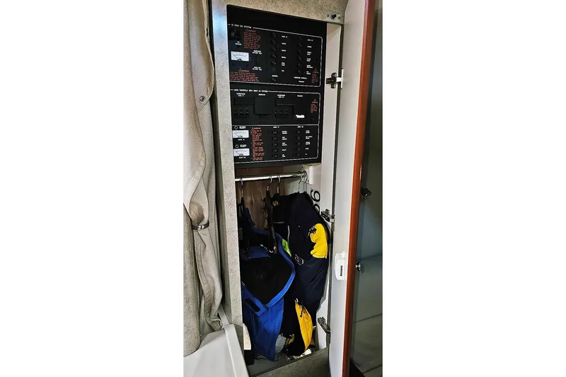 Slide: The Image of Electrical panel and storage inside a 2006 Formula 37 Performance Cruiser boat. - 21