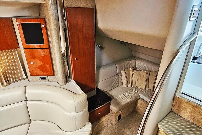 Slide: The Image of Interior of 2006 Formula 37 Performance Cruiser with plush seating and wooden cabinetry. - 6