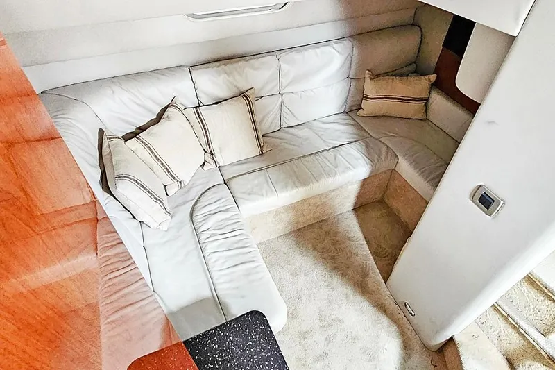 Slide: The Image of Luxurious interior of a 2006 Formula 37 Performance Cruiser with plush white seating. - 7