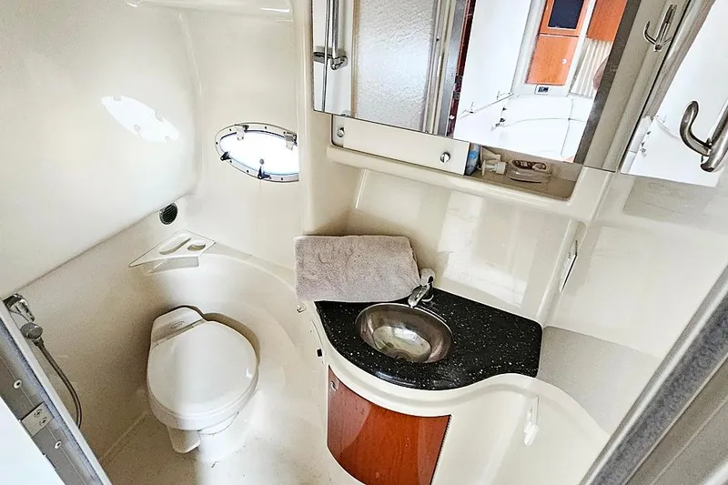 Slide: The Image of 2006 Formula 37 Performance Cruiser bathroom with toilet, sink, and mirror. - 8