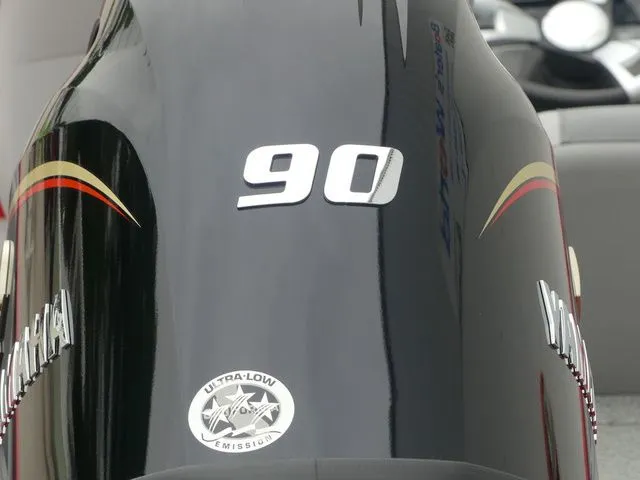 Slide: The Image of Yamaha outboard motor with 90 HP and Ultra-Low Emission sticker. - 16
