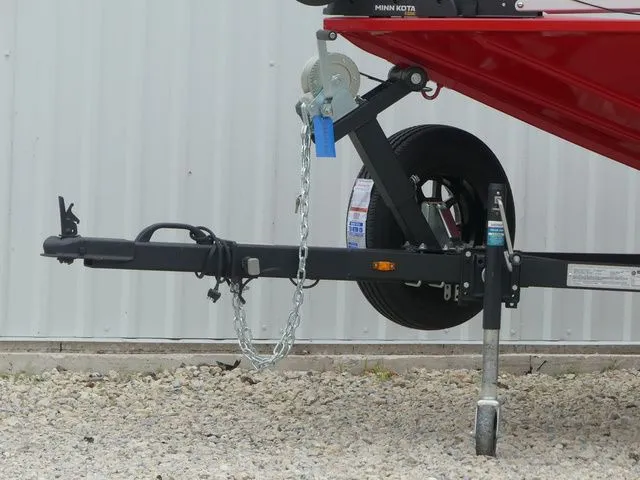 Slide: The Image of Trailer of a 2026 G3 Sportsman 1710 boat on gravel surface. - 8
