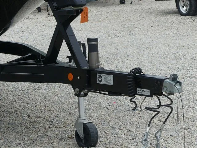 Slide: The Image of Trailer of a 2020 MasterCraft NXT22 boat on gravel surface. - 10