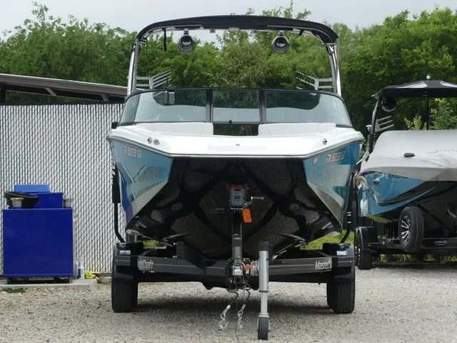 Slide: The Image of 2020 MasterCraft NXT22 boat on trailer, front view. - 11