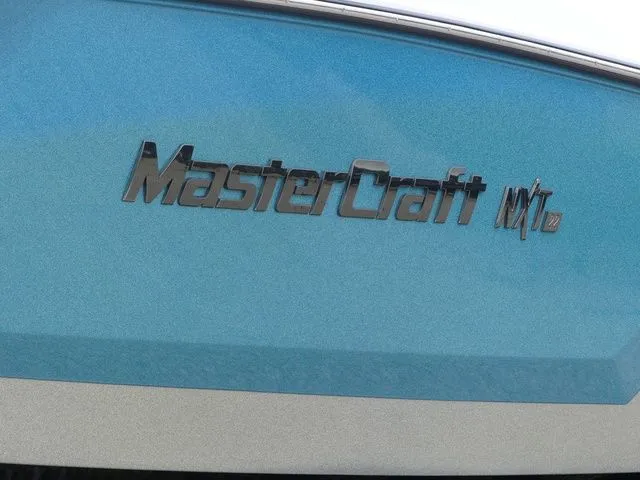 Slide: The Image of MasterCraft NXT22 2020 boat logo on blue background. - 12