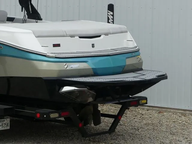 Slide: The Image of Rear view of a 2020 MasterCraft NXT22 boat on a trailer. - 16