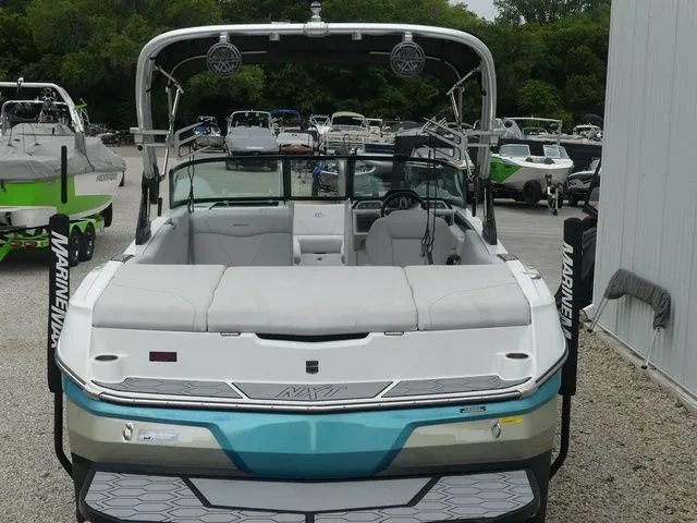 Slide: The Image of 2020 MasterCraft NXT22 boat in a parking lot, front view. - 19