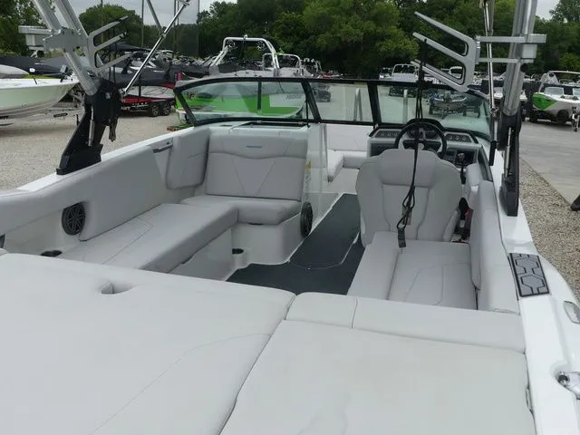 Slide: The Image of Interior of a 2020 MasterCraft NXT22 boat with gray seating. - 23
