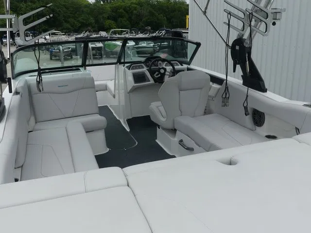 Slide: The Image of Interior view of a 2020 MasterCraft NXT22 boat with white seating. - 24