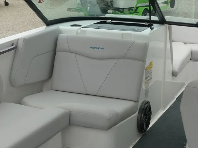 Slide: The Image of Interior of a 2020 MasterCraft NXT22 boat with gray seating. - 26