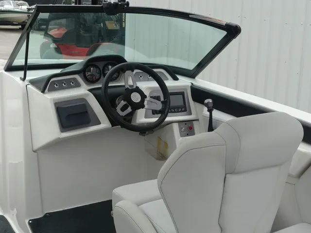 Slide: The Image of Interior of a 2020 MasterCraft NXT22 boat with steering console. - 34