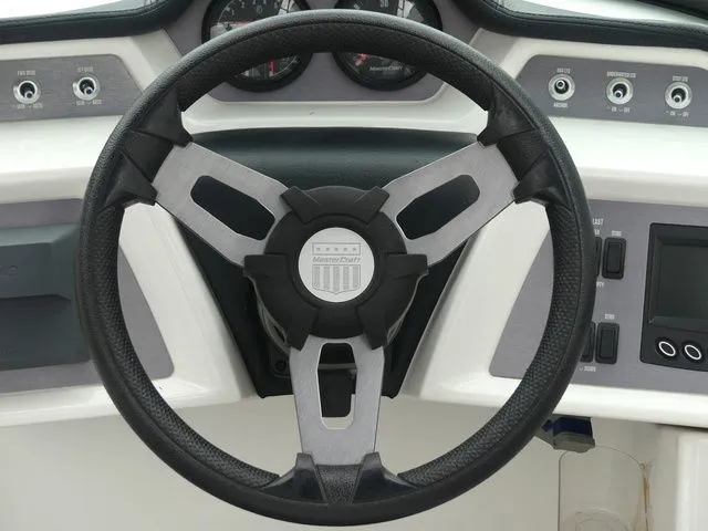 Slide: The Image of Steering wheel of a 2020 MasterCraft NXT22 boat, close-up. - 36