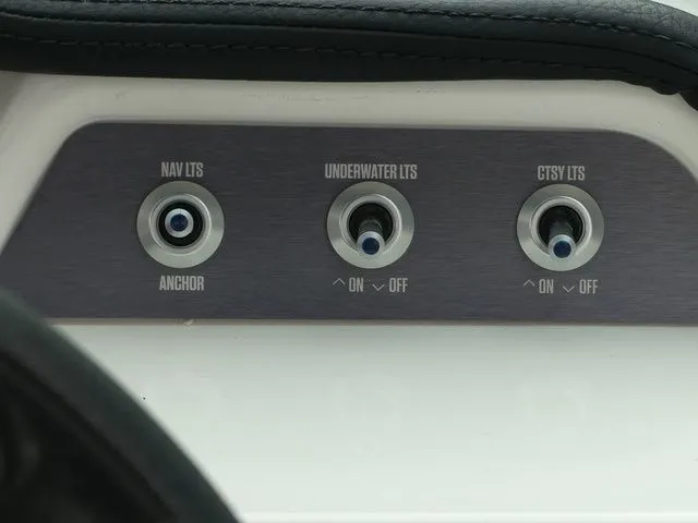 Slide: The Image of 2020 MasterCraft NXT22 light switches panel. - 38