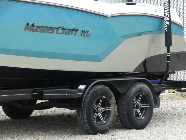 Slide: The Image of 2020 MasterCraft NXT22 boat on trailer, side view. - 8