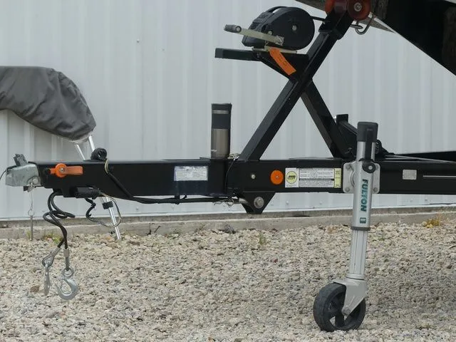 Slide: The Image of Trailer of a 2020 MasterCraft NXT22 boat on gravel surface. - 9
