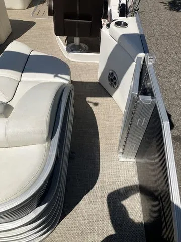Slide: The Image of Interior of a 2019 Bennington 23 QLC pontoon boat with seating area. - 11