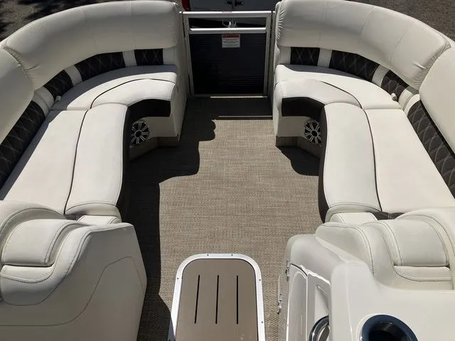 Slide: The Image of Interior of a 2019 Bennington 23 QLC pontoon boat with white seating. - 19