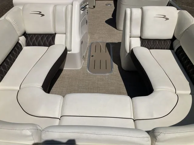 Slide: The Image of Interior of a 2019 Bennington 23 QLC pontoon boat with white seating. - 21