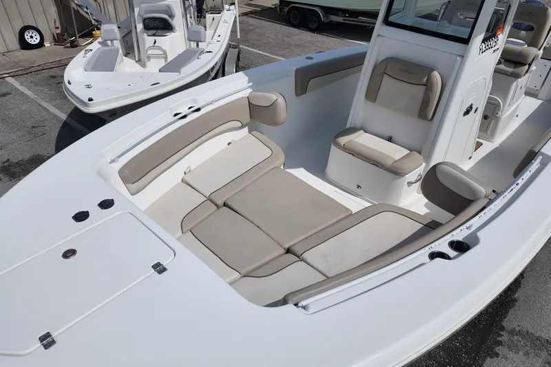 Slide: The Image of 2026 NAUTIC STAR 28 XS boat interior with beige seating and modern design. - 12