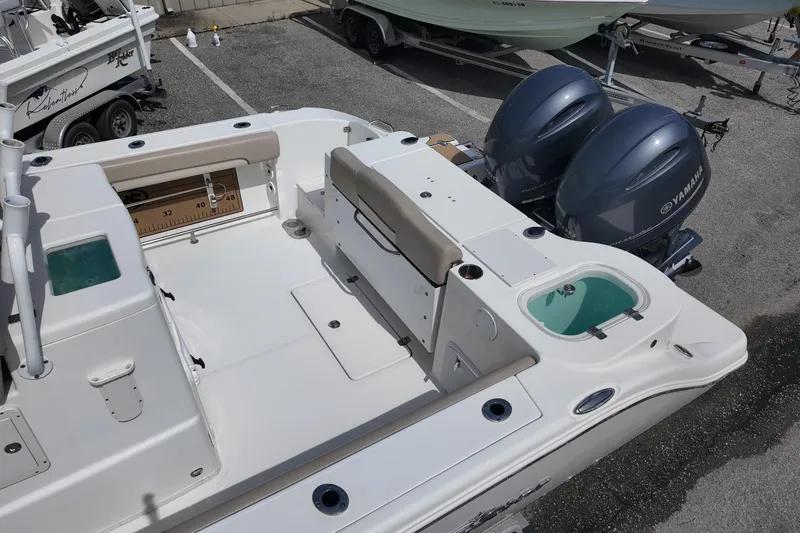 Slide: The Image of 2026 NAUTIC STAR 28 XS boat with dual Yamaha engines, spacious deck, and seating area. - 16