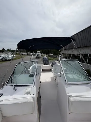 Slide: The Image of 2000 Grady-White Tournament 192 boat with Bimini top and glass windows. - 11