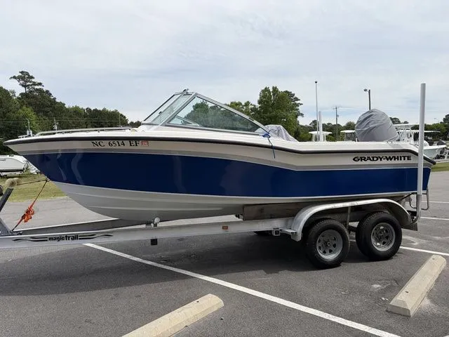 Slide: The Image of 2000 Grady-White Tournament 192 boat parked on trailer outdoors. - 2