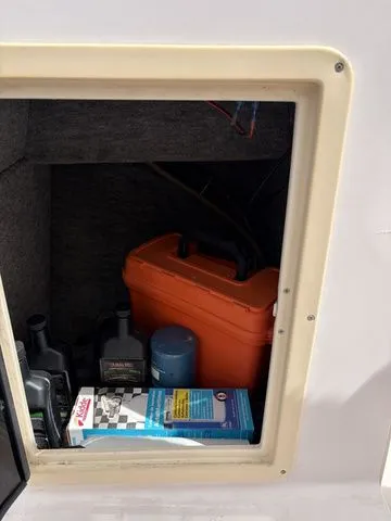 Slide: The Image of Storage compartment of a Grady-White Tournament 192 boat with accessories. - 9
