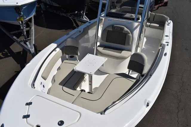Slide: The Image of 2026 Key West 203 FS boat with seating area and table. - 14