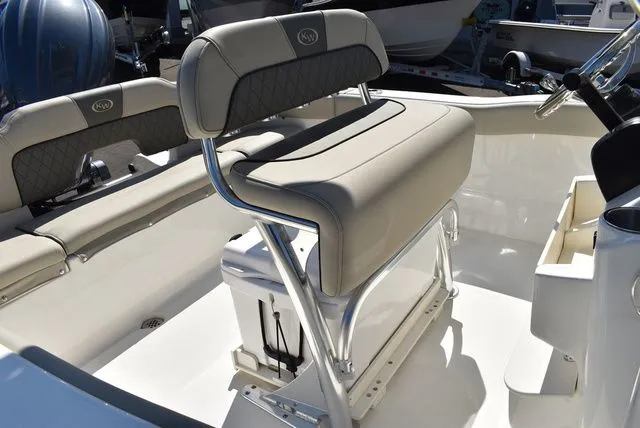 Slide: The Image of Interior of Key West 203 FS boat, 2026 model, featuring beige seating. - 19