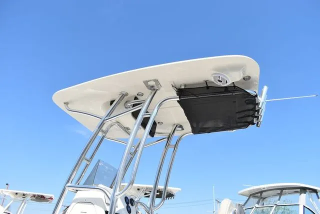 Slide: The Image of Key West 203 FS 2026 boat with T-top under blue sky. - 20