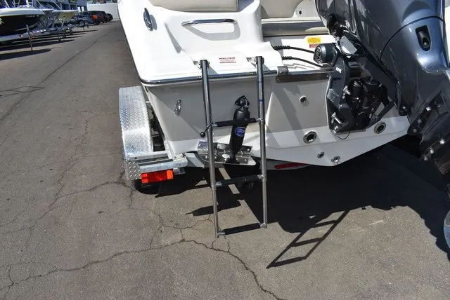 Slide: The Image of Rear view of a 2026 Key West 203 FS boat with motor and ladder. - 21