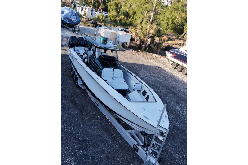 The Image of 2024 Nor-Tech 400 Supersport boat on trailer in outdoor setting. - 1