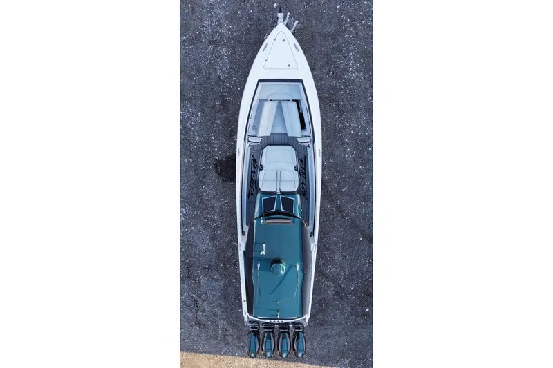 Slide: The Image of Aerial view of 2024 Nor-Tech 400 Supersport boat on water. - 12