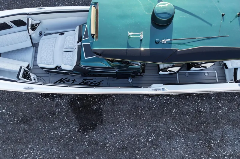 Slide: The Image of 2024 Nor-Tech 400 Supersport boat, aerial view showcasing sleek design and luxurious seating. - 15
