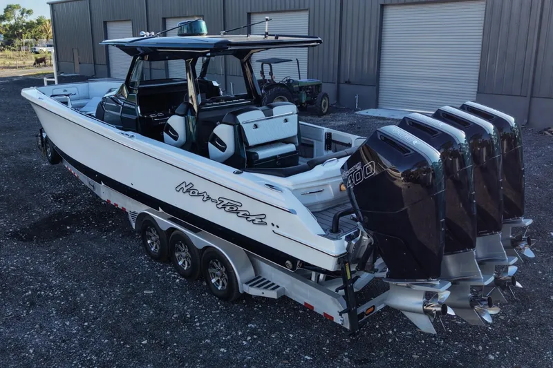 Slide: The Image of 2024 Nor-Tech 400 Supersport boat with quad engines on a trailer. - 16