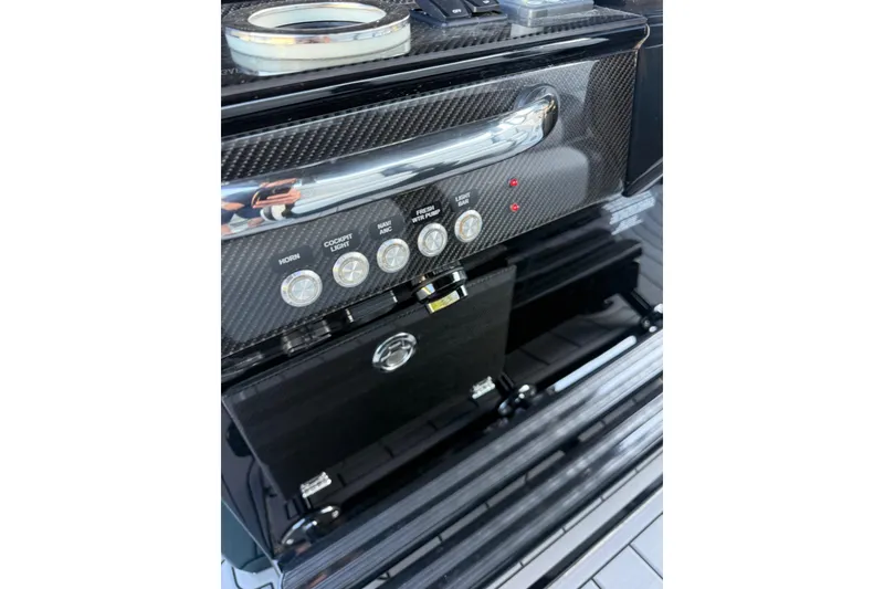 Slide: The Image of Control panel of 2024 Nor-Tech 400 Supersport boat with carbon fiber finish. - 17