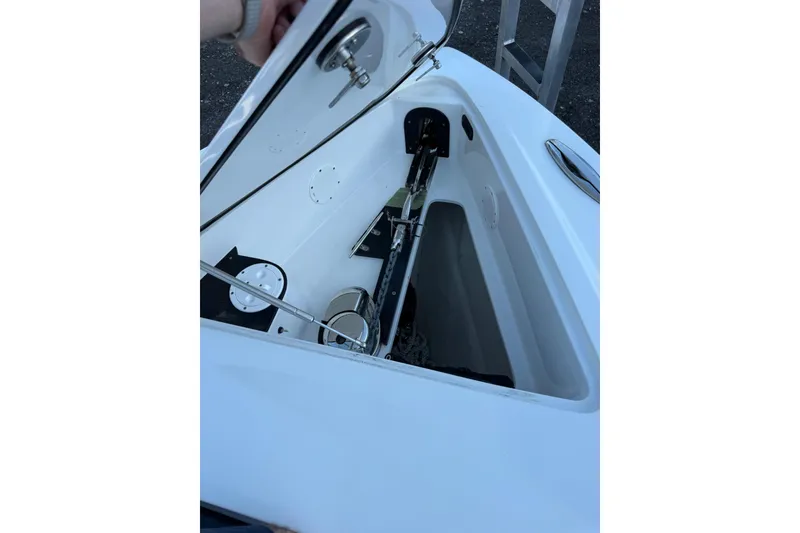 Slide: The Image of Open storage compartment of 2024 Nor-Tech 400 Supersport boat, showcasing interior details. - 18