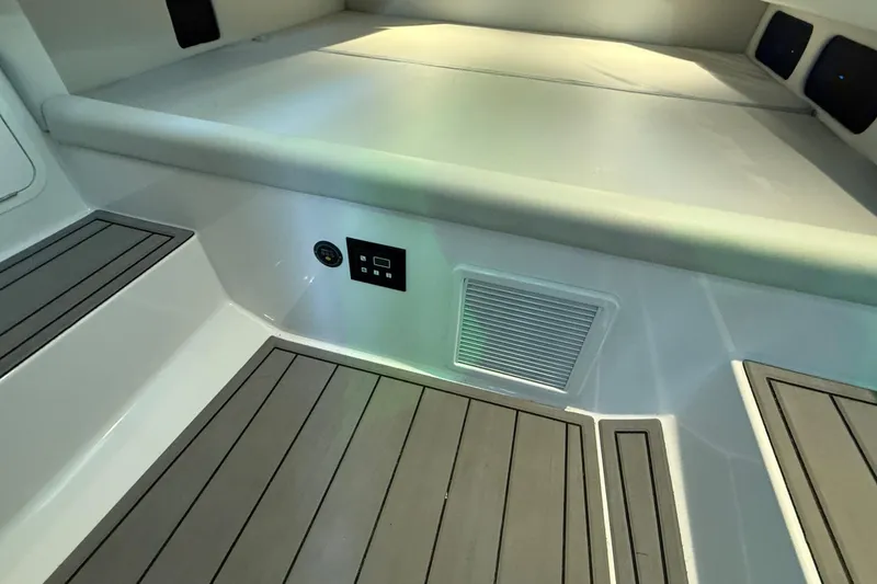 Slide: The Image of 2024 Nor-Tech 400 Supersport interior with sleek flooring and modern amenities. - 20