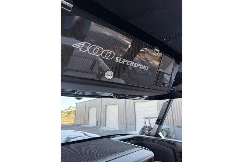 Slide: The Image of 2024 Nor-Tech 400 Supersport boat interior with carbon fiber detailing. - 23