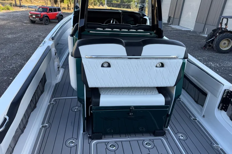 Slide: The Image of 2024 Nor-Tech 400 Supersport boat interior with luxurious seating and modern design. - 34