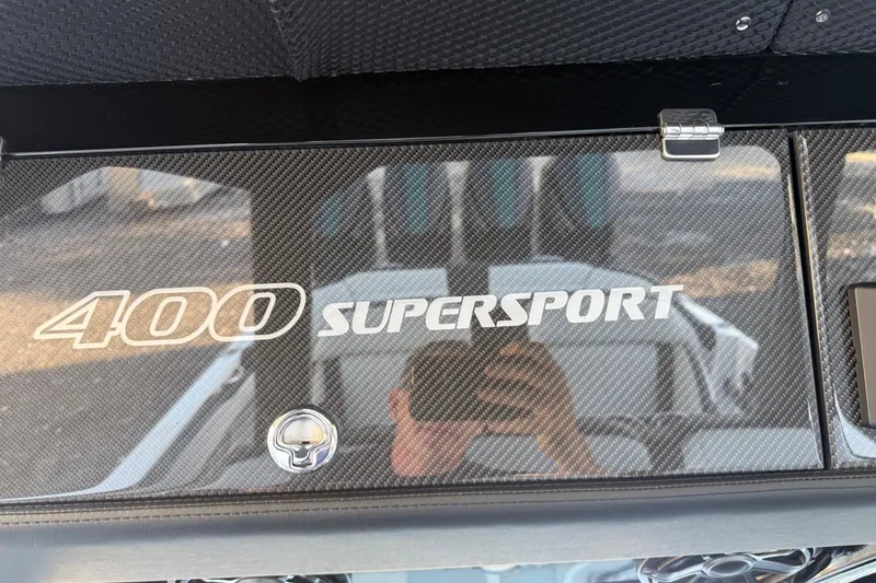 Slide: The Image of 2024 Nor-Tech 400 Supersport dashboard with carbon fiber finish and logo. - 37